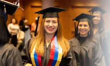 Herzing Tennessee Online BSN Student Smiling at Graduation Ceremony